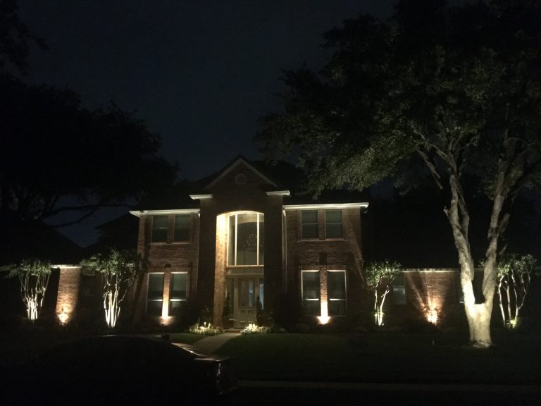 A home with lighting on their porch. Landscape Lighting Services Dallas, TX